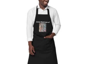 a man wearing a black designer apron