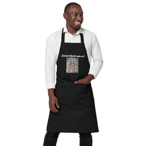 a man wearing a black designer apron