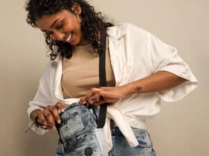 a woman looking at a bag